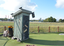 Spela golf genom kaptenens dass